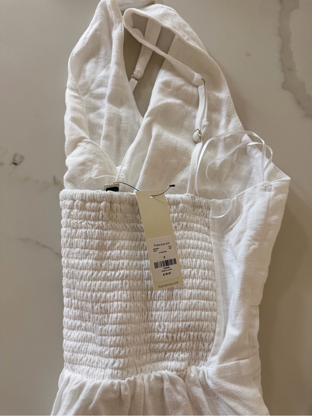 Francesca's Collections White Smocked romper with Adjustable Strap